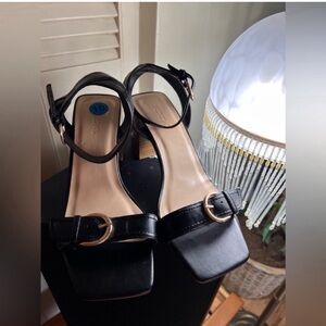 Elegant Black Heels with Gold Buckle by Soda